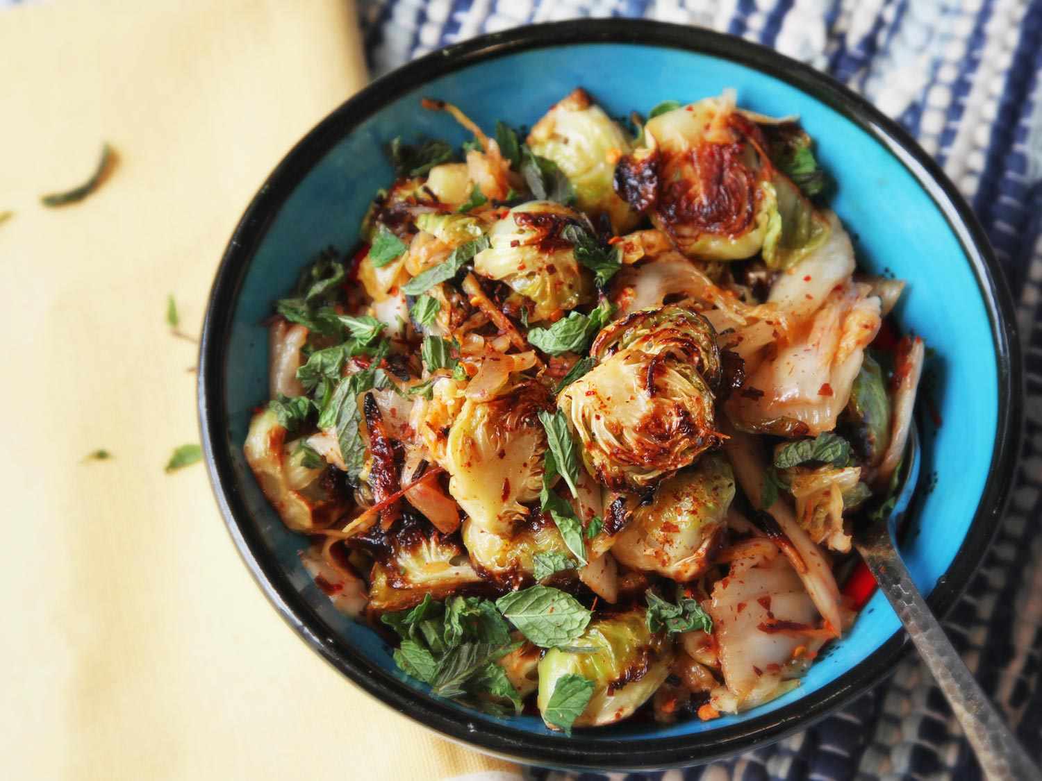 Roasted Brussels Sprouts With Kimchi and Ginger Recipe 4 Bowl of Brussels sprouts tossed with kimchi.