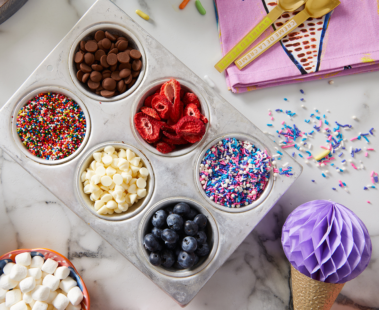 muffin tin with ice cream toppings