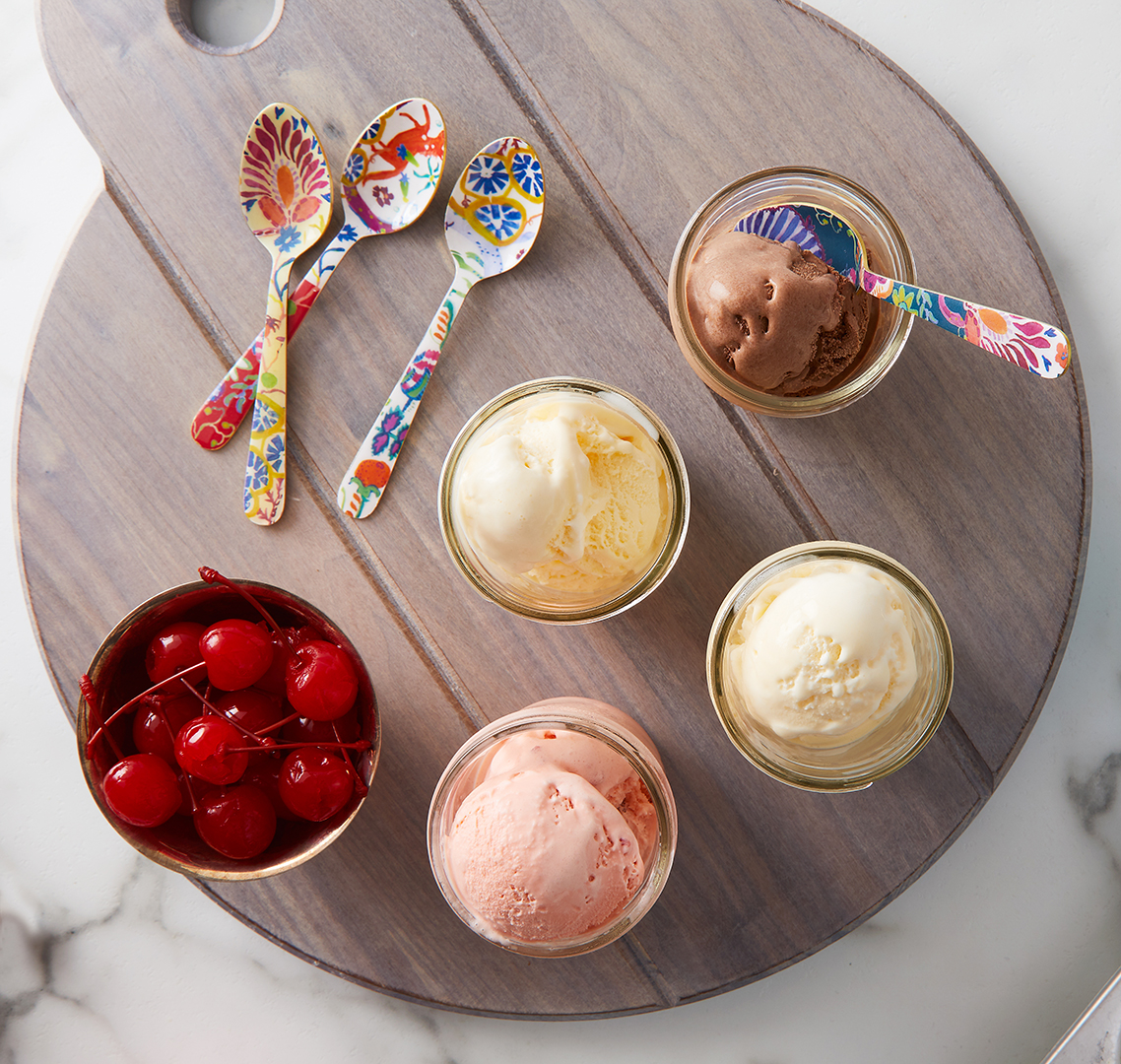 bowls of ice cream and tray of toppings