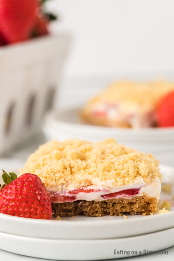 These strawberry crunch bars are easy to make and very delicious! This no bake strawberry crunch bars recipe with cookies is perfect for any occasion. These strawberry cookie bars are simple to make. You are going to love these strawberry crumb bars! #eatingonadime #easydesserts #strawberrydesserts These strawberry crunch bars are easy to make and very delicious! This no bake strawberry crunch bars recipe with cookies is perfect for any occasion. These strawberry cookie bars are simple to make. You are going to love these strawberry crumb bars! #eatingonadime #easydesserts #strawberrydesserts
