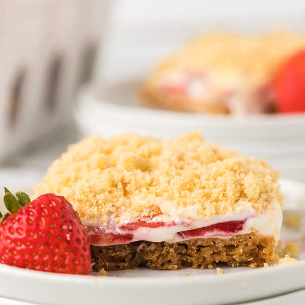 These strawberry crunch bars are easy to make and very delicious! This no bake strawberry crunch bars recipe with cookies is perfect for any occasion. These strawberry cookie bars are simple to make. You are going to love these strawberry crumb bars! #eatingonadime #easydesserts #strawberrydesserts These strawberry crunch bars are easy to make and very delicious! This no bake strawberry crunch bars recipe with cookies is perfect for any occasion. These strawberry cookie bars are simple to make. You are going to love these strawberry crumb bars! #eatingonadime #easydesserts #strawberrydesserts