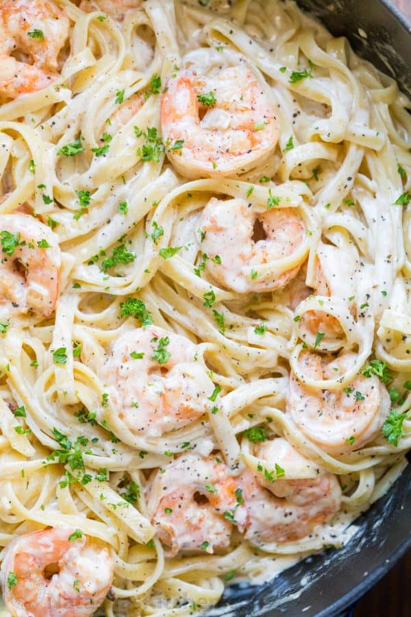Creamy Shrimp Pasta reminds me of my favorite dish at Olive Garden with plump juicy shrimp and the easiest alfredo sauce. Rave reviews on this shrimp pasta! | natashaskitchen.com