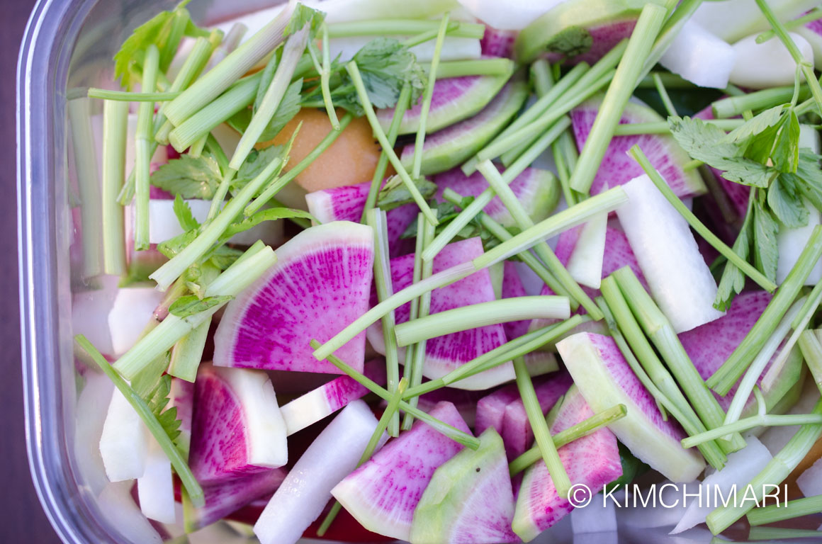 Water Kimchi (물김치 Mul Kimchi) with Watermelon Radish 18 Water Kimchi ingredients in container