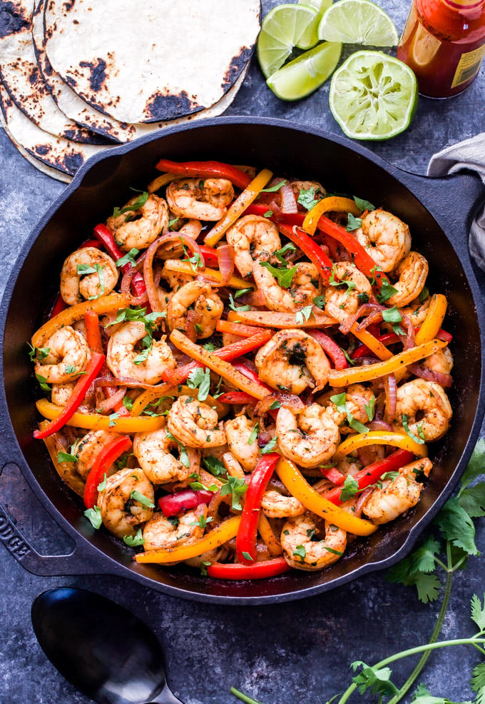 Skillet Shrimp Fajitas couldn't be easier to make and they'll be on your table in 30 minutes or less! Paleo, gluten-free and a great alternative to chicken or beef! #shrimp #fajitas #paleo #glutenfree #healthydinner