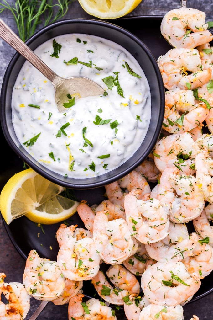 Lemon Dill Grilled Shrimp with Yogurt Herb Sauce are a healthy, fast and flavorful weeknight dinner or party appetizer! On the table in 30 minutes or less and gone in less time than that! #shrimp #grilling #easydinner #appetizer #seafood #glutenfree