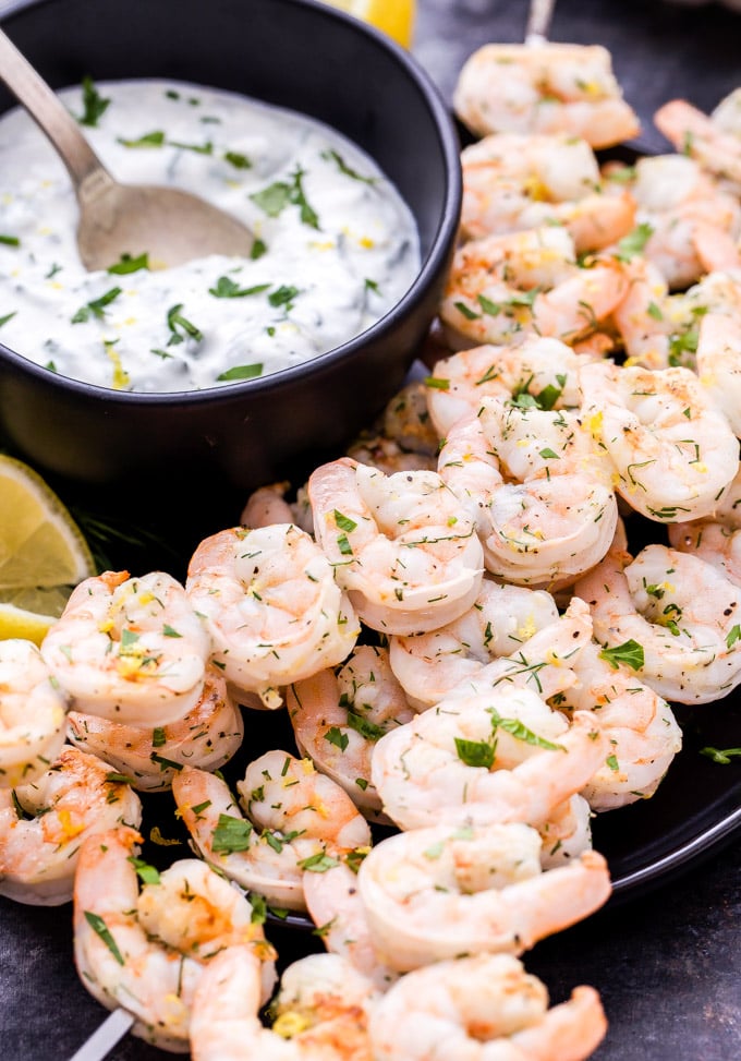 Lemon Dill Grilled Shrimp with Yogurt Herb Sauce are a healthy, fast and flavorful weeknight dinner or party appetizer! On the table in 30 minutes or less and gone in less time than that! #shrimp #grilling #easydinner #appetizer #seafood #glutenfree