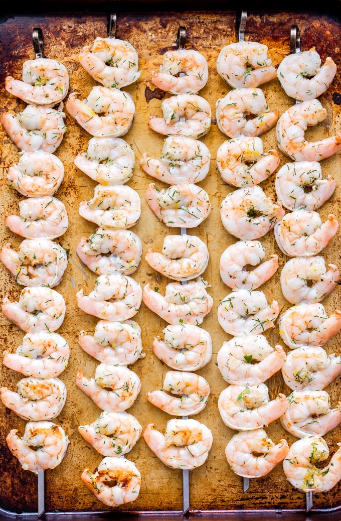 Lemon Dill Grilled Shrimp with Yogurt Herb Sauce are a healthy, fast and flavorful weeknight dinner or party appetizer! On the table in 30 minutes or less and gone in less time than that! #shrimp #grilling #easydinner #appetizer #seafood #glutenfree