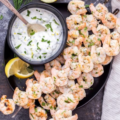 Lemon Dill Grilled Shrimp with Yogurt Herb Sauce are a healthy, fast and flavorful weeknight dinner or party appetizer! On the table in 30 minutes or less and gone in less time than that! #shrimp #grilling #easydinner #appetizer #seafood #glutenfree