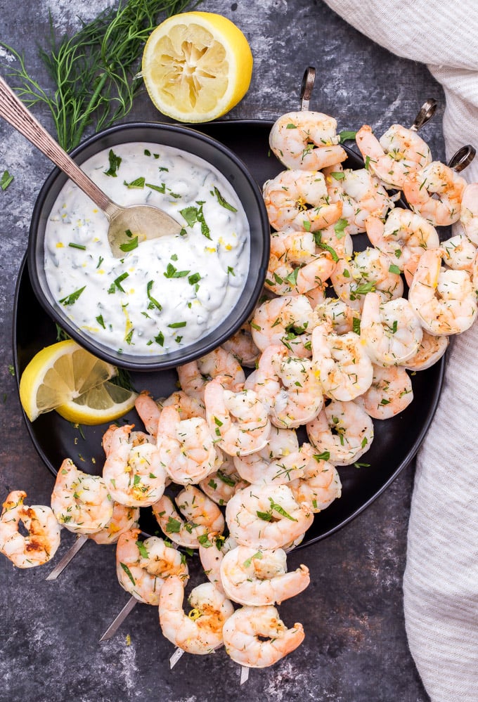 Lemon Dill Grilled Shrimp with Yogurt Herb Sauce are a healthy, fast and flavorful weeknight dinner or party appetizer! On the table in 30 minutes or less and gone in less time than that! #shrimp #grilling #easydinner #appetizer #seafood #glutenfree