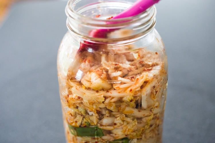 How to make Kimchi that only takes 30 minutes of hands-on-time before mother nature takes over! Full of healthy, gut-healing probiotics, this authentic kimchi recipe is vegan adaptable & gluten free. Quick and easy, make it as spicy or mild as you like. #kimchi #howtomakekimchi #vegan #vegankimchi #eatclean #cleaneating #plantbased #napa cabbage #kimchirecipe #probiotics #fermented #guthealing #fermentedcabbage #koreanfood #koreanrecipe 