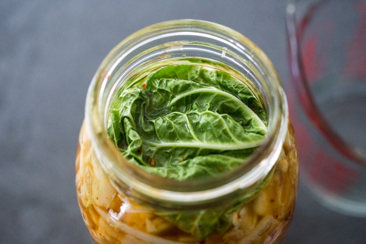 How to make Kimchi that only takes 30 minutes of hands-on-time before mother nature takes over! Full of healthy, gut-healing probiotics, this authentic kimchi recipe is vegan adaptable & gluten free. Quick and easy, make it as spicy or mild as you like. #kimchi #howtomakekimchi #vegan #vegankimchi #eatclean #cleaneating #plantbased #napa cabbage #kimchirecipe #probiotics #fermented #guthealing #fermentedcabbage #koreanfood #koreanrecipe 