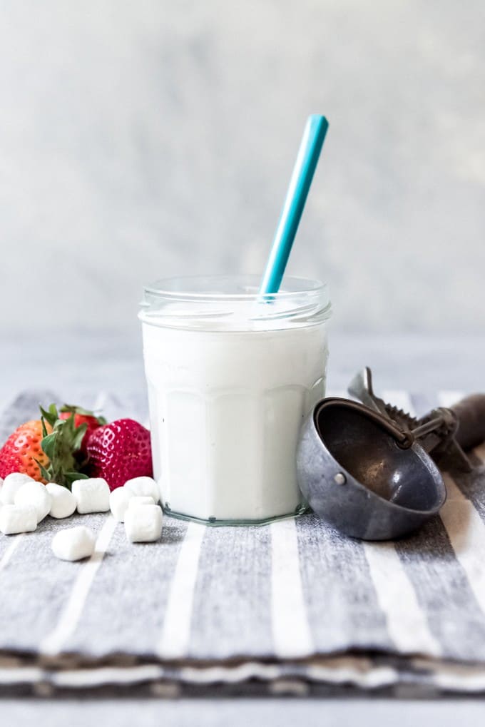 An image of a jar of homemade marshmallow ice cream sauce.
