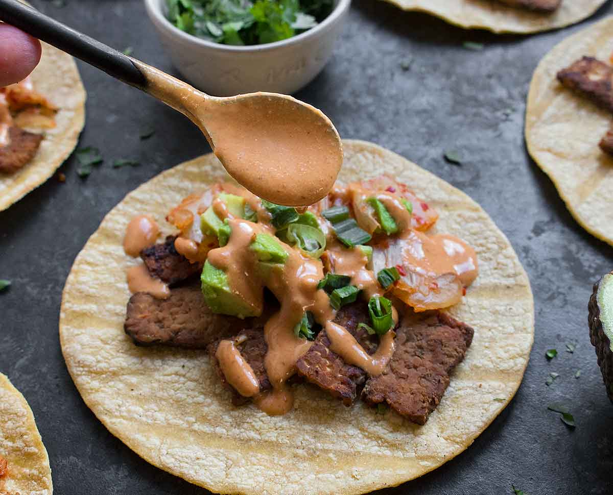 Kimchi Tacos with Gochujang Aioli 9 Gochujang aioli spooned onto a kimchi taco.