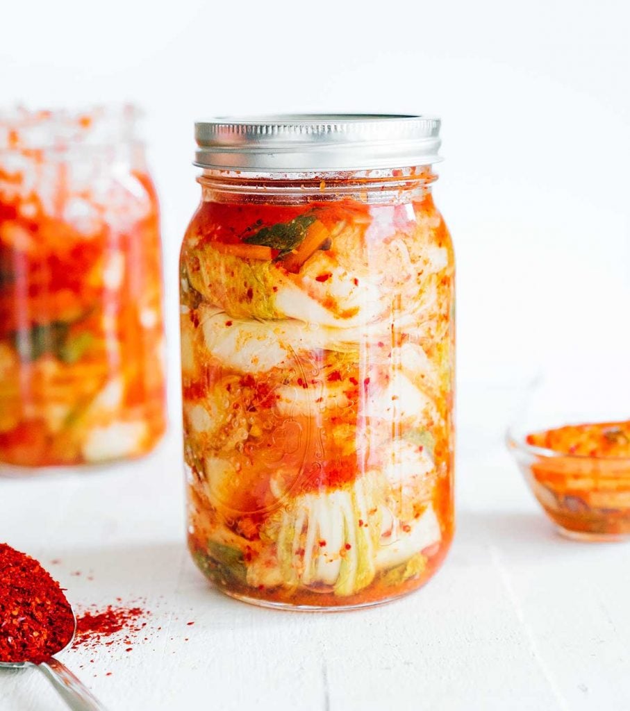 Kimchi 101: How to Make Kimchi (No Fish Sauce) 15 Homemade kimchi in a mason jar with white background