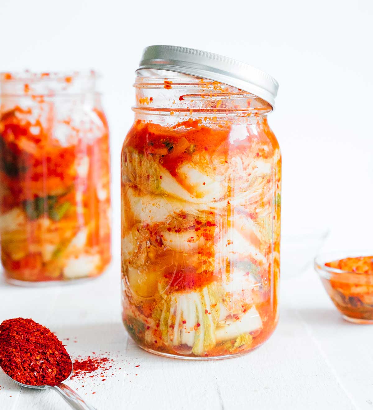 Kimchi 101: How to Make Kimchi (No Fish Sauce) 24 Homemade kimchi in a mason jar with white background