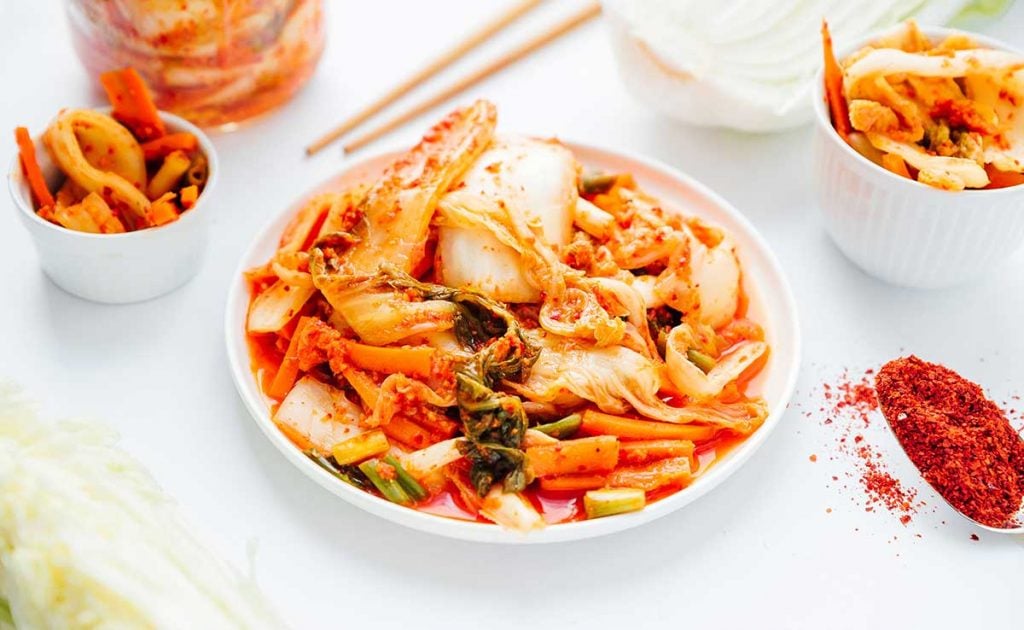 Kimchi 101: How to Make Kimchi (No Fish Sauce) 16 Kimchi on a plate with white background