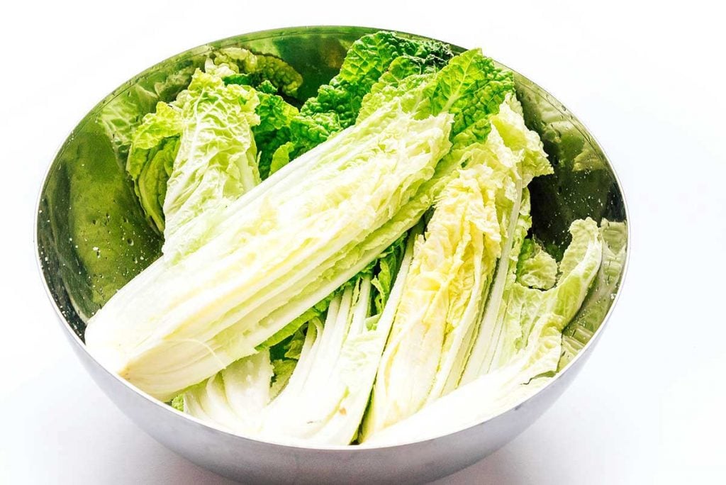 Kimchi 101: How to Make Kimchi (No Fish Sauce) 19 Fresh cabbage in a bowl on a white background