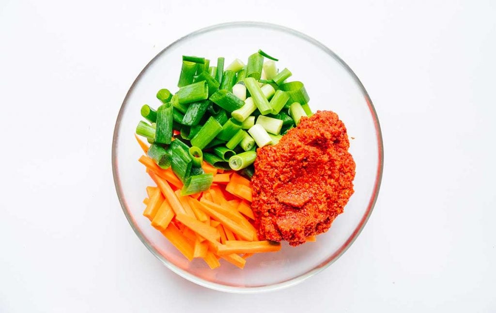 Kimchi 101: How to Make Kimchi (No Fish Sauce) 22 Ingredients to make kimchi in a glass bowl