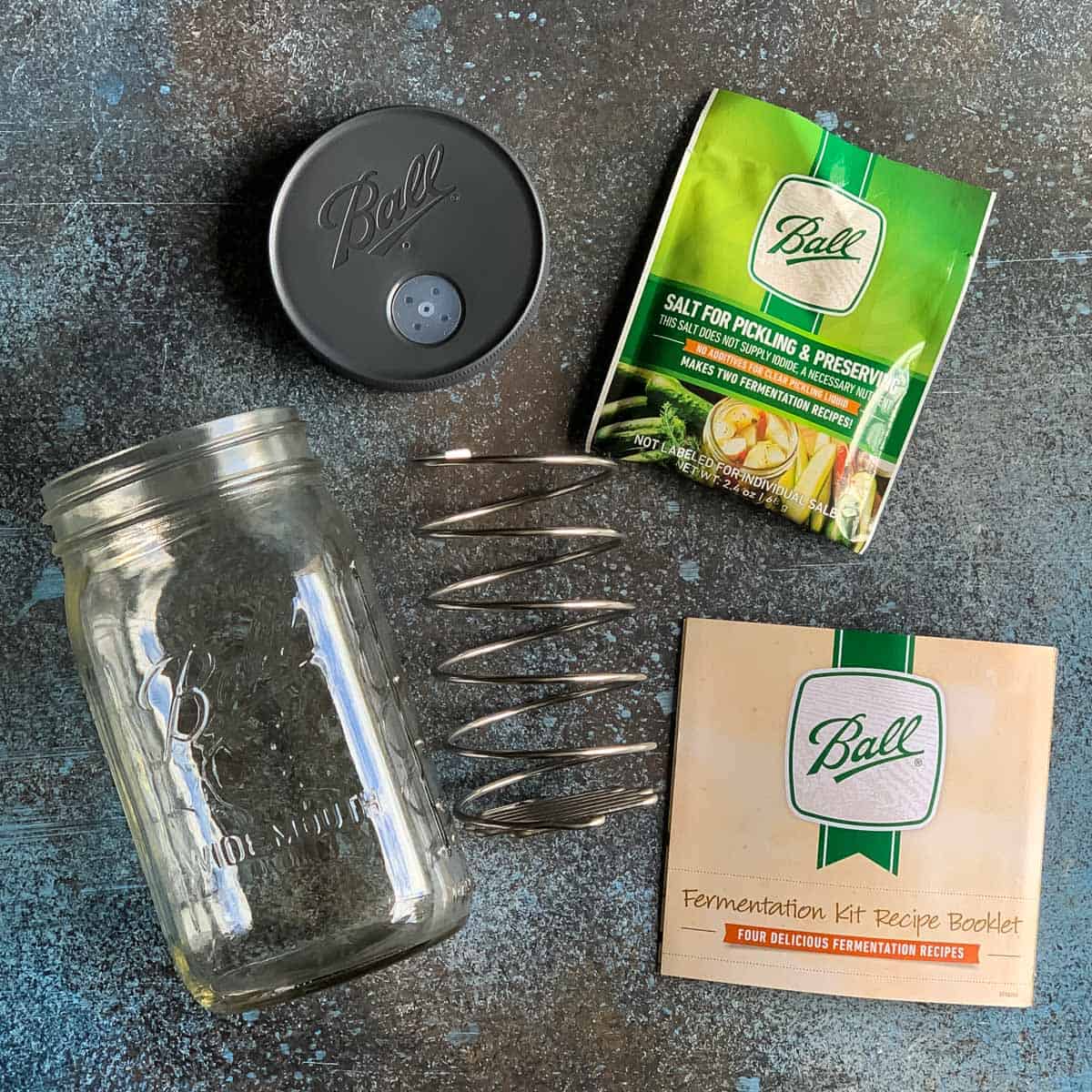 Kimchi is a spicy Korean side dish that is traditionally fermented, similar to sauerkraut. It is usually made with napa cabbage along with other vegetables like carrots, onions, ginger, and garlic. Korean chili flakes give it a spicy kick! Kimchi is surprisingly easy to make and so delicious! ball fermentation kit pieces