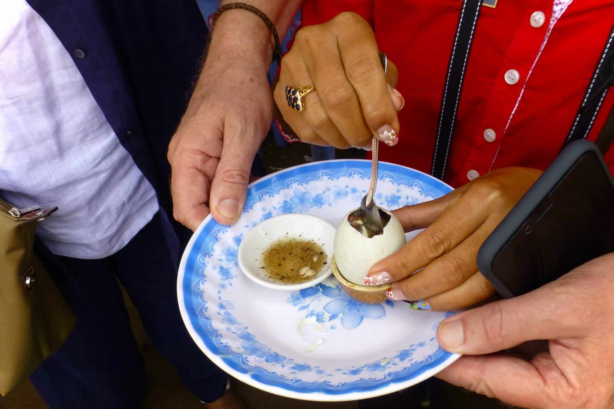 Hello controversy: we tried balut egg at a Cambodian market - Luc & June Travel & Food Blog 9 Balut Egg 1 scaled