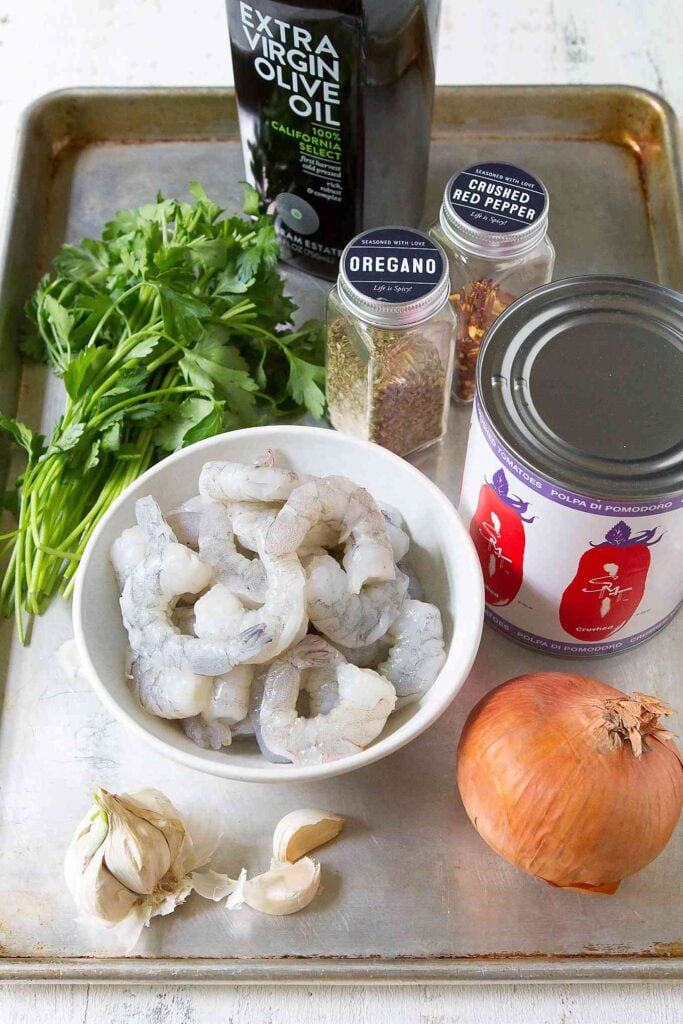Shrimp in Red Sauce Recipe 14 Ingredients for shrimp in tomato sauce recipe, all on baking sheet.