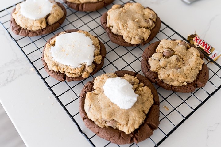 S'mores Brownie Cookie (Crumbl Copycat) - Cooking With Karli 14 marshmallow cream being added to the top of the smores brownie cookies