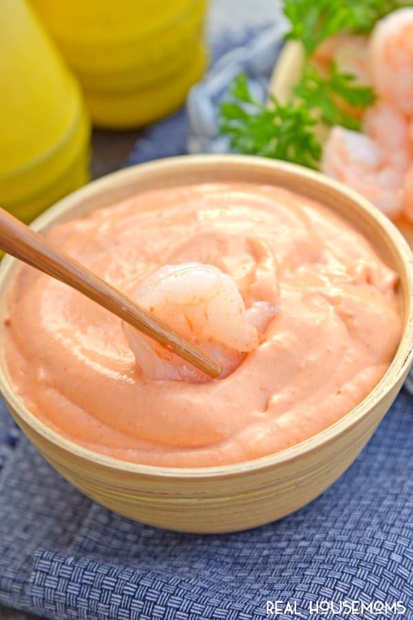 Yum Yum Sauce 10 Chop sticks dipping shrimp into a bowl of Yum Yum Sauce